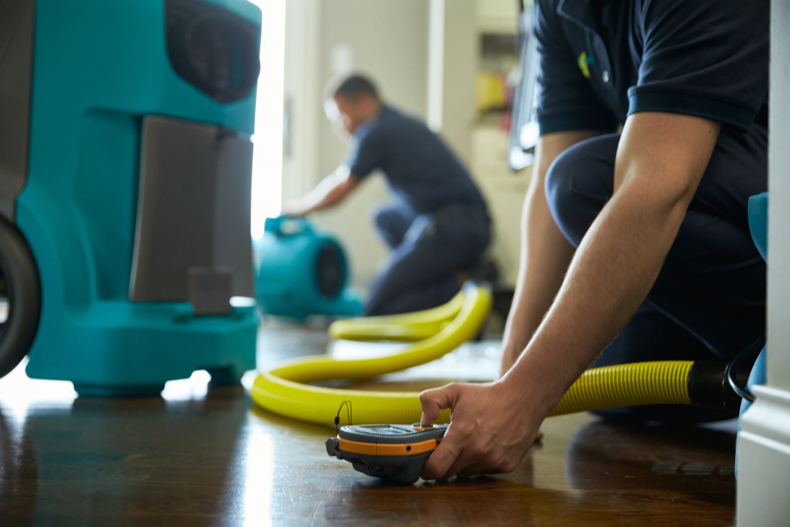 Repairmen working to restore property